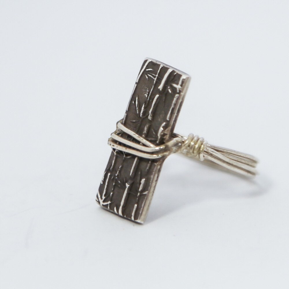 Sterling silver ring with wrapped silver rectangle.