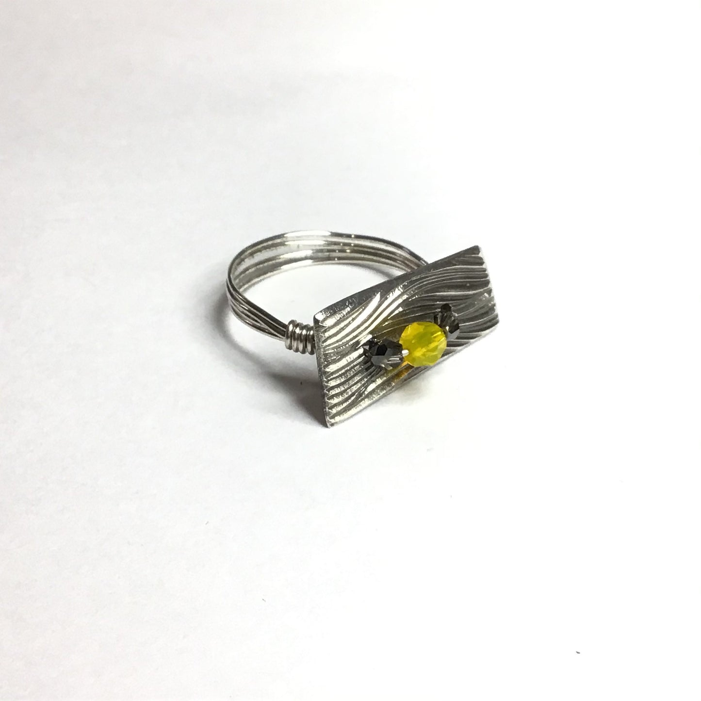 Sterling silver ring with yellow opal and pyrite Swarovski crystals.