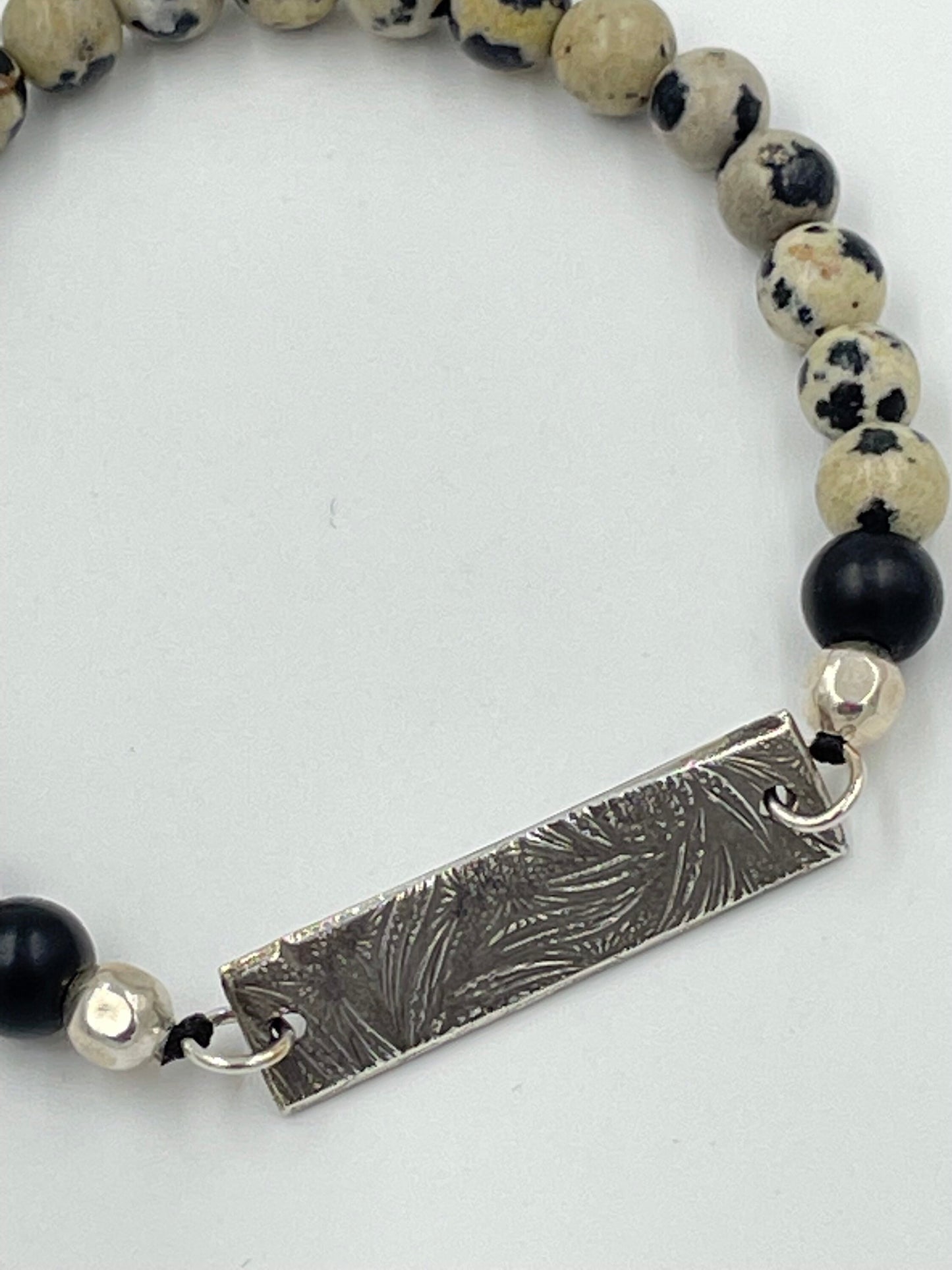 Dalmatian jasper, black obsidian bracelet with silver beads and silver clay centerpiece.