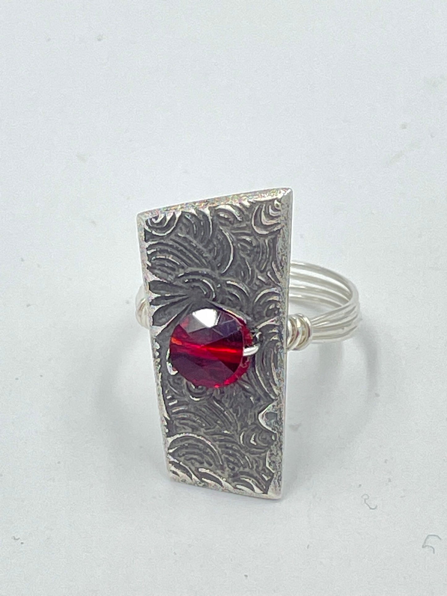 Sterling silver ring with ruby red Swarovski crystal.