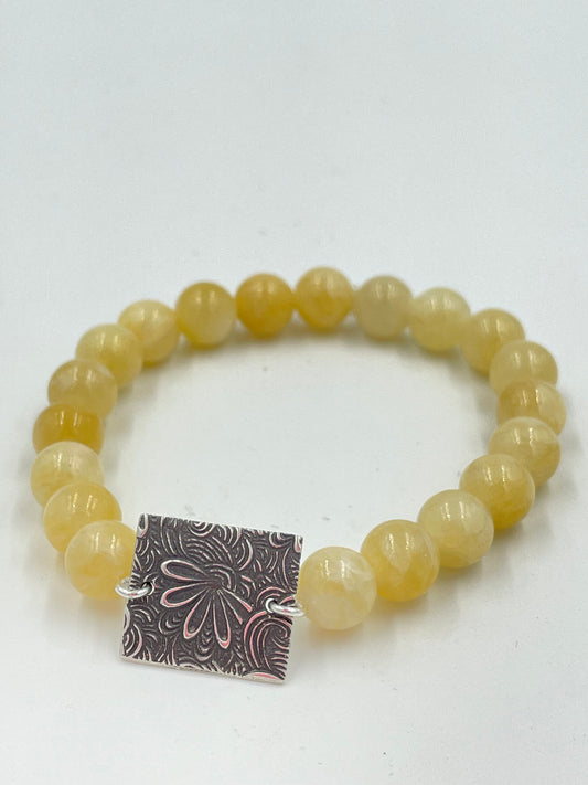 Honey jade bracelet with sterling silver centrepiece.