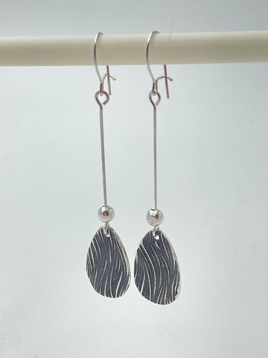 Handmade silver teardrop earrings with silver bead.