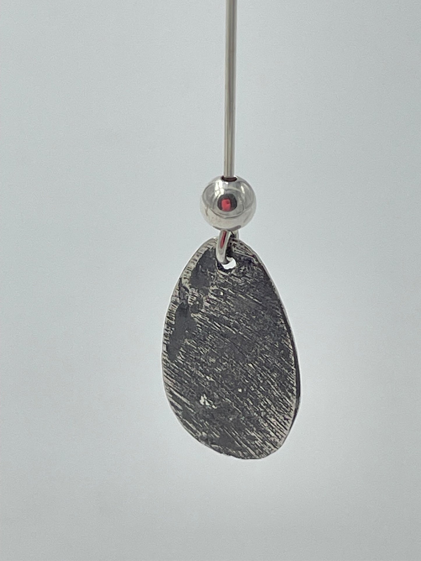 Handmade silver teardrop earrings with silver bead.